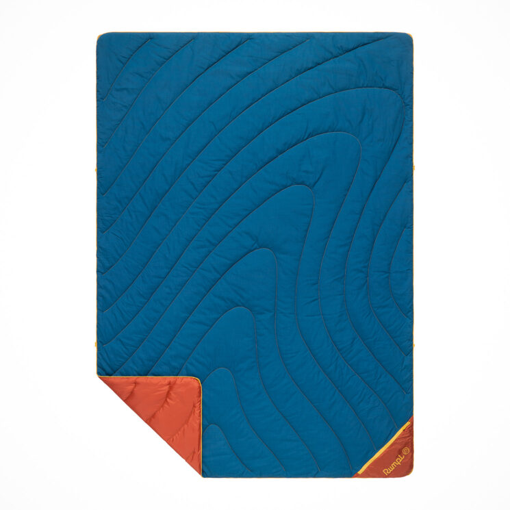 Rumpl's Deep Ember insulated camp blanket features an ember-resistant shell offering a layer of protection that traditional synthetic camping gear lacks.